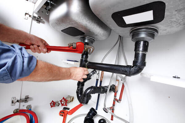 bigstock-Hands-of-professional-Plumber--52258234